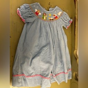 Play condition. Nativity Scene Smocked Dress. Size 2